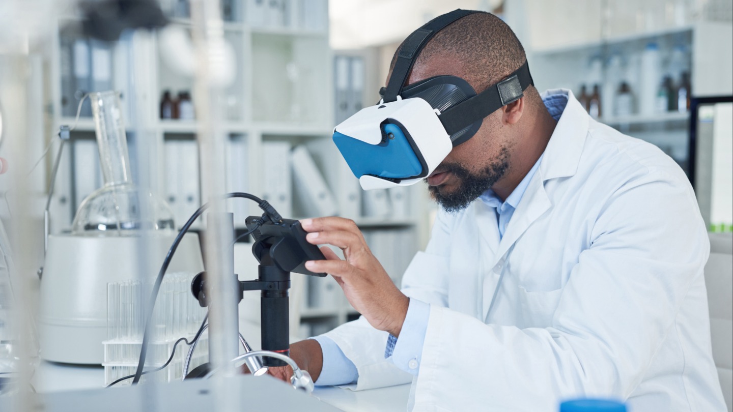 decorative image of scientist wearing VR headset while looking at data