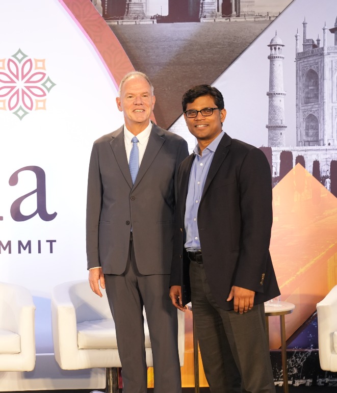 Dean Garrett and the BITSoM Dean in front of the USC-India Innovation Summit Sign